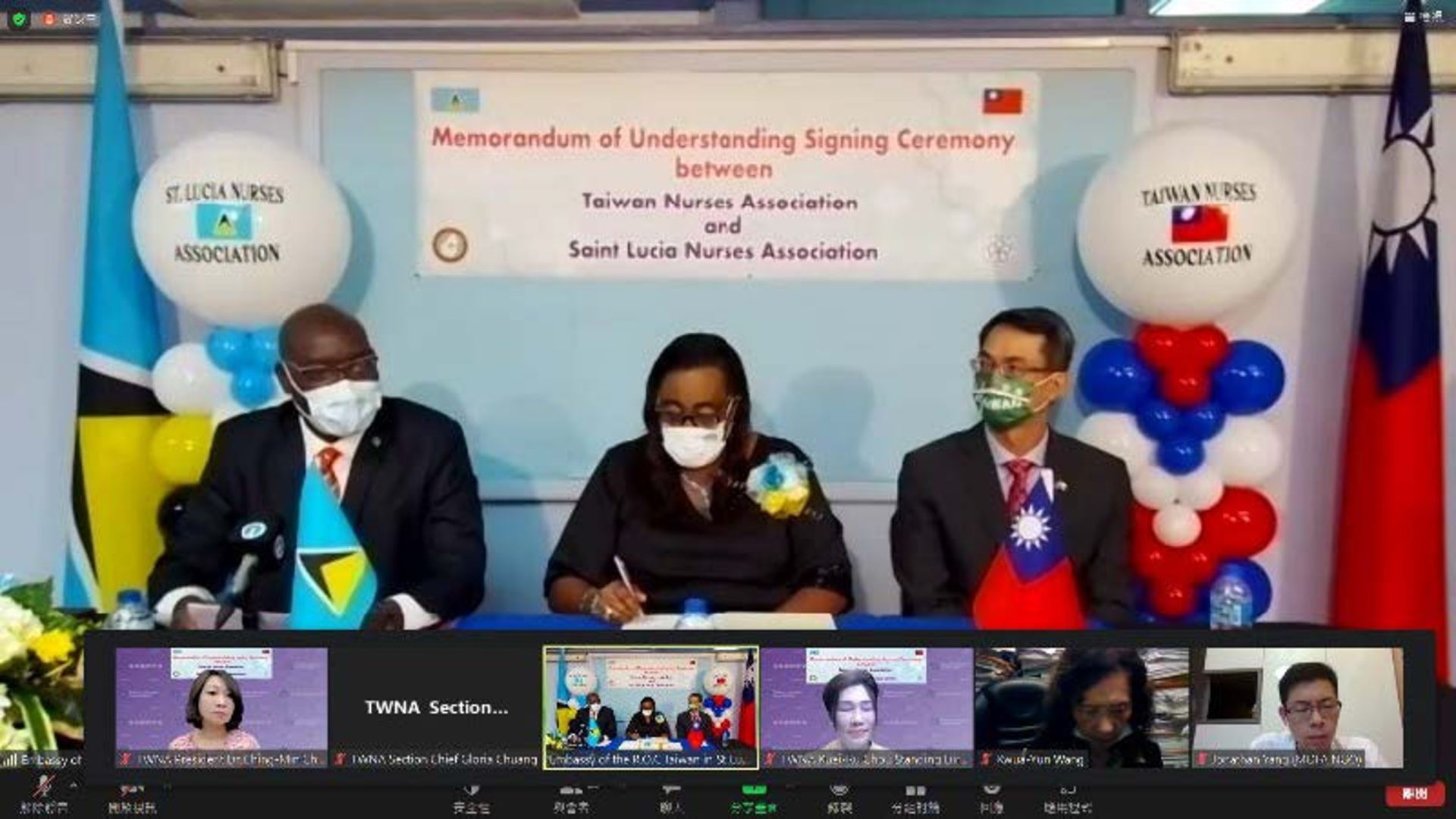 Alicia Baptiste, president of SLNA (center) signs a memorandum of understanding. R.O.C. Ambassador Peter Chia-yen Chen (right) and Saint Lucia Health Minister Moses Jean Baptiste (left) witness the signing.