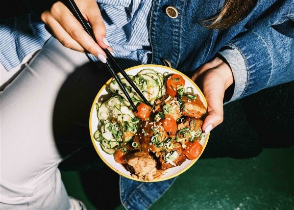 Pork belly rice with Jou Jou’s Bites’ homemade pickled cucumbers. Delicious food is a universal language.