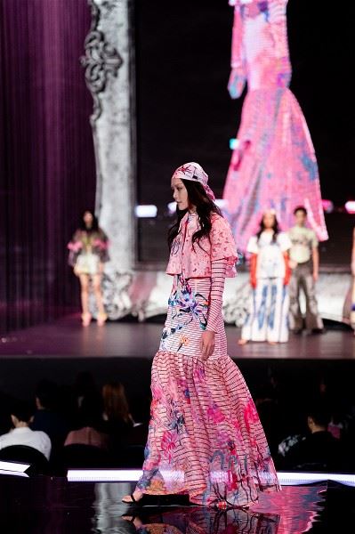 Vibrant colors, bold prints, and hand-painted floral and animal motifs are signatures of the Claudia Wang brand.