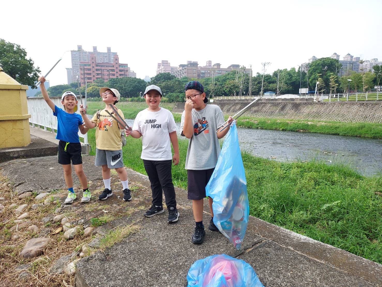 Young generation in action, elementary school students participating in the cleanup activity